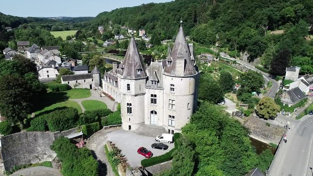 Aerial 4K footage, over the valley. World heritage Durbuy Castle in Belgium, province of Luxembourg in the Wallonia region. Beautiful landscape with river, sunny weather during summer season.