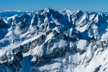 Fototapeta na wymiar Winter snowy view from the Lomnica Peak in High Tatras mountains, Slovakia