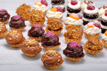 Sweet cookies, closeup of various kinds of cakes on event or wedding reception