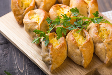 Rasstegai pie with fish filling and rice , egg. Traditional meal of Russian cuisine.