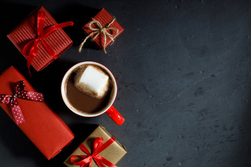 A cup of hot chocolate with marshmallow in red Christmas theme