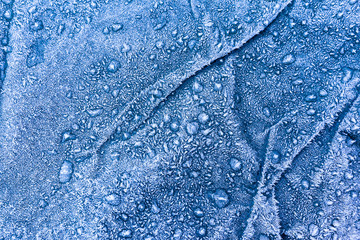 Winter texture of frost and ice on a tarpaulin.