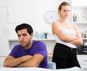 Man at home table after quarrel with wife