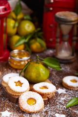 Linzer Christmas cookies with tangerine jam and sugar powder. Delicious biscuits. Sweet dessert