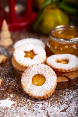 Linzer Christmas cookies with tangerine jam and sugar powder. Delicious biscuits. Sweet dessert
