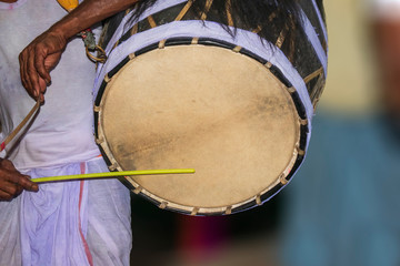 Fototapeta na wymiar A drummer called dhaki in bengal or west bengal plays a special drum called dhak during the Durga Puja festival