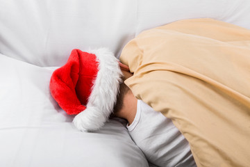 Man in Santa Hat sleeping