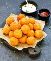 cheese balls with tomato sauce.