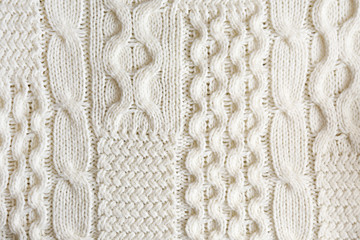 Cropped close up shot of seamless woolen knitting pattern of fall / winter season warm sweater,...