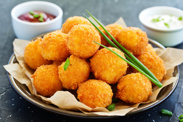 cheese balls with tomato sauce.