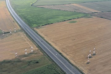 Aerial view of a road and agricultural land.