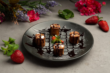 sweet roll - chocolate pancake, strawberries, banana, orange, butter cream