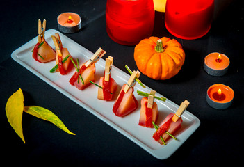 Slices of Patagonian toothfish fillet marinated in beet brandy with marinated baked bell pepper