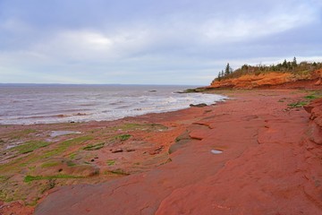 View of Burntcoat Head Park, a red rock park on the Bay of Fundy with the largest tides in the world