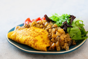 French Omelette with Potatoes, Mushroom and Salad