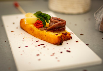 Anchovy toast with asparagus, cheese and extra virgin olive oil