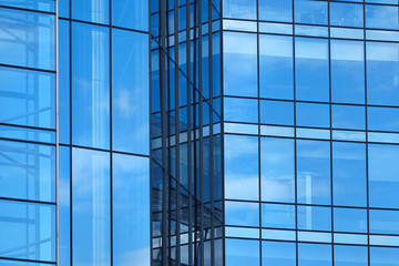Blue windows of skyscraper. A fragment of a glass facade of a modern office building in a business...