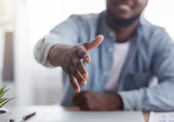 HR manager extending hand for handshake after successful job interview