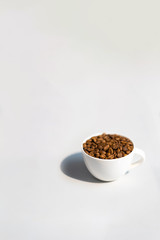 Coffee beans in a cup with Bokeh