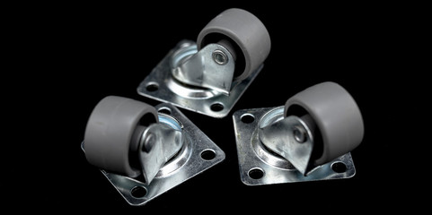 Three metal and rubber wheels