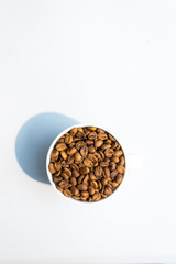 Obraz na płótnie Canvas Coffee Beans in a Cup