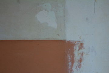 Old Wall of a Residential House With Shabby Stucco