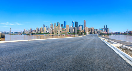 Fototapeta premium Empty asphalt highway and modern city financial district in chongqing,China.