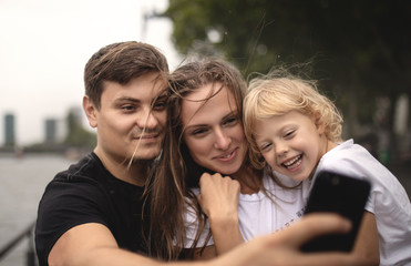 Beautiful family posing selfie.