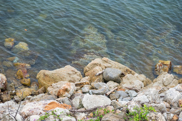 The rocky shore of the sea. Turquoise beautiful water.