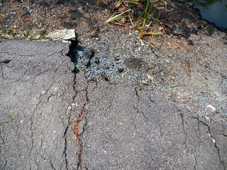 Asphalt floor is broke,On a hot day,At market Bangkachao Bangkok Thailand