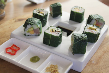 Signature Laupele Sushi with spinach leaves and Breadfruit taco at the back from Nourish Cafe, Samoa.
