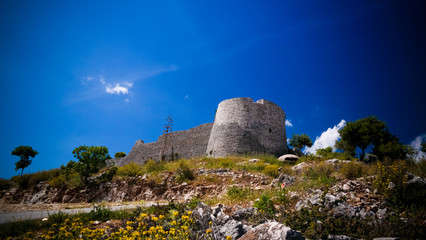 Fototapeta na wymiar Landscape with the Lekuresi Castle and military bunkers, Saranda, Albania