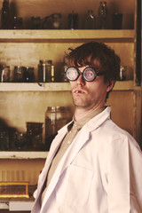 Creepy scientist portrait in laboratory