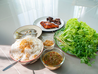 Thai food name is Maing PLA-too or salad fried fish,Street food in Bangkok, Include grilled Chicken Grilled liver Grilled heart Rice Vermicelli Fried fish Lettuce and coriander,Healthy for body