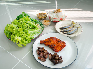 Thai food name is Maing PLA-too or salad fried fish,Street food in Bangkok, Include grilled Chicken Grilled liver Grilled heart Rice Vermicelli Fried fish Lettuce and coriander,Healthy for body