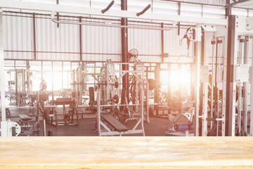 Empty top of fitness gym and wooden deck tabletop.For product display