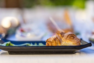 Tasty croissant sandwich with cheese and ham