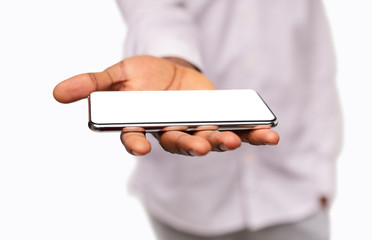 Man holding modern smartphone with blank screen on open palm