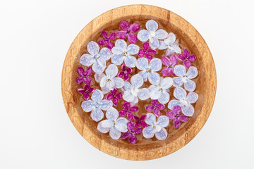 Lilac flowers in a bamboo bowl