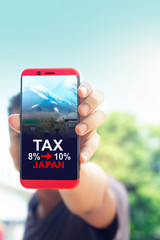 Mobile phones and messages Concept Tax or VAT 10 percent. of Japan