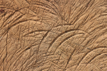 The surface of the wood that is cut with a saw blade causes scratches.