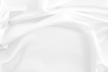 White fabric texture that is white silk background with beautiful soft blur pattern.