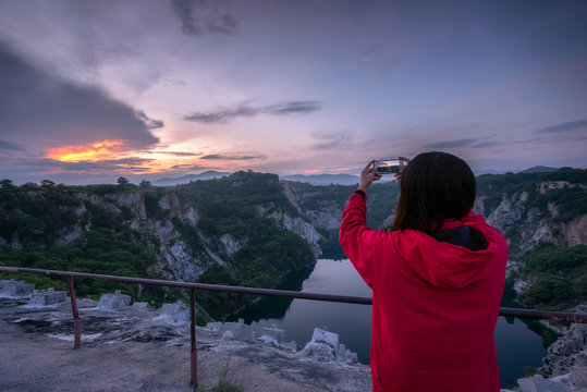 Asian women take pictures of grand canyon in Thailand