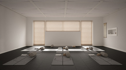 Empty yoga studio interior design, open space with mats, pillows and accessories, venetian bamboo blinds, herringbone parquet, big window, ready for yoga practice, meditation room