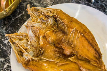 Deep fried whole sea bass with fish sauce