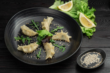 gedza syumai steamed chinese dumplings with shrimp and vegetables, served with sauce