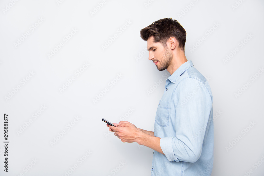 Poster profile side photo of concentrated man at copyspace using his cellphone reading feednews in social n