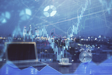 Forex market chart hologram and personal computer background. Double exposure. Concept of investment.