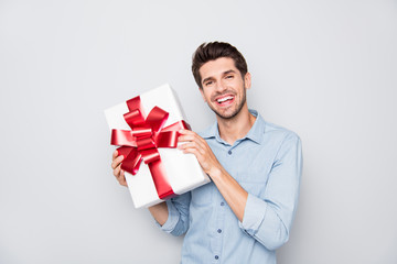 Portrait of cheerful candid lover man hold big wish gift box on valentine day holidays prepare for...