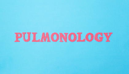 Fototapeta na wymiar Inscription pulmonology on a blue background. Concept sections of medicine dealing with the treatment of pneumonia and diseases of the lungs and respiratory tract